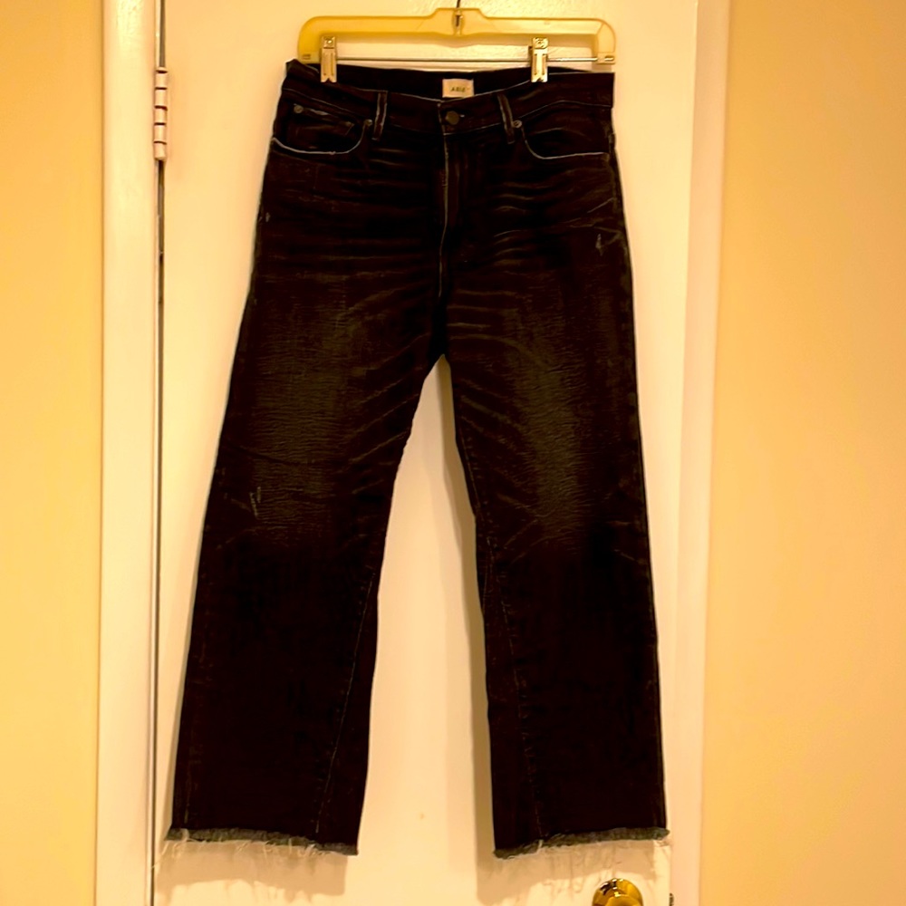 Black ankle high rise jeans.